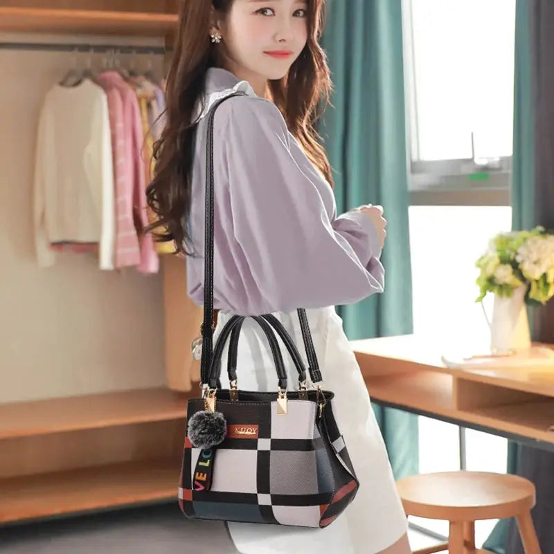 Elegant PU leather handbag with black-and-white checkered pattern, top handles and crossbody strap