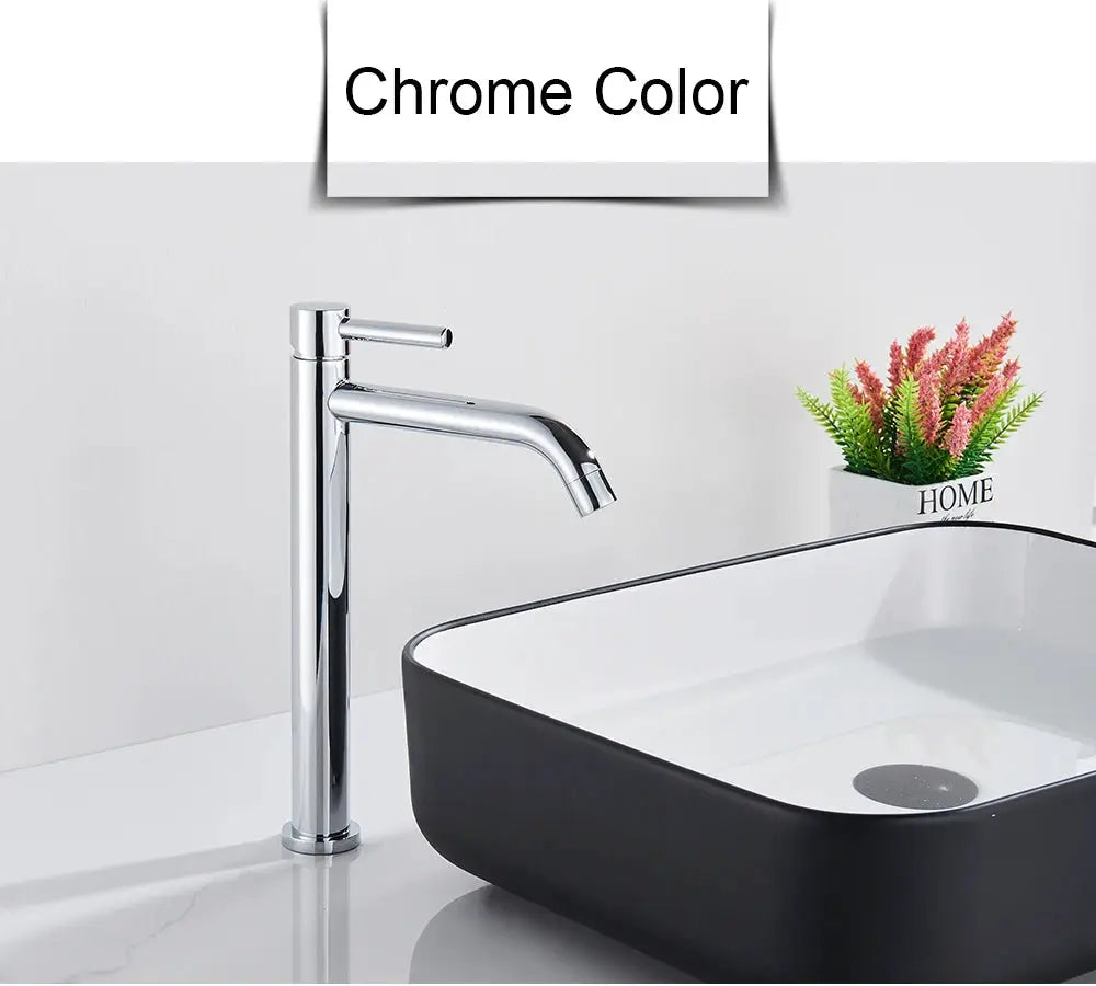 Simples Market chrome basin faucet with tall cylindrical body and lever handle over a white sink