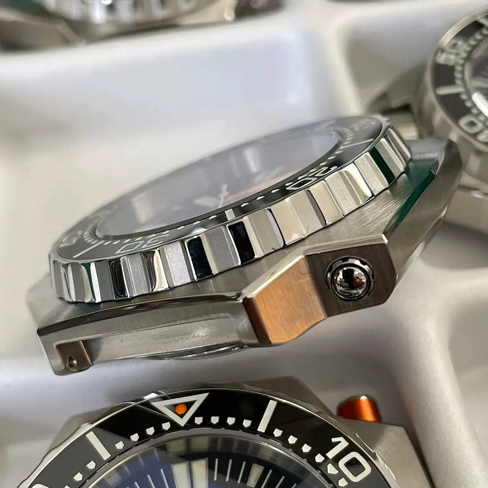 Steeldive Proplof SD1969 V3 56mm dive watch; stainless steel case with black bezel, two watches visible.