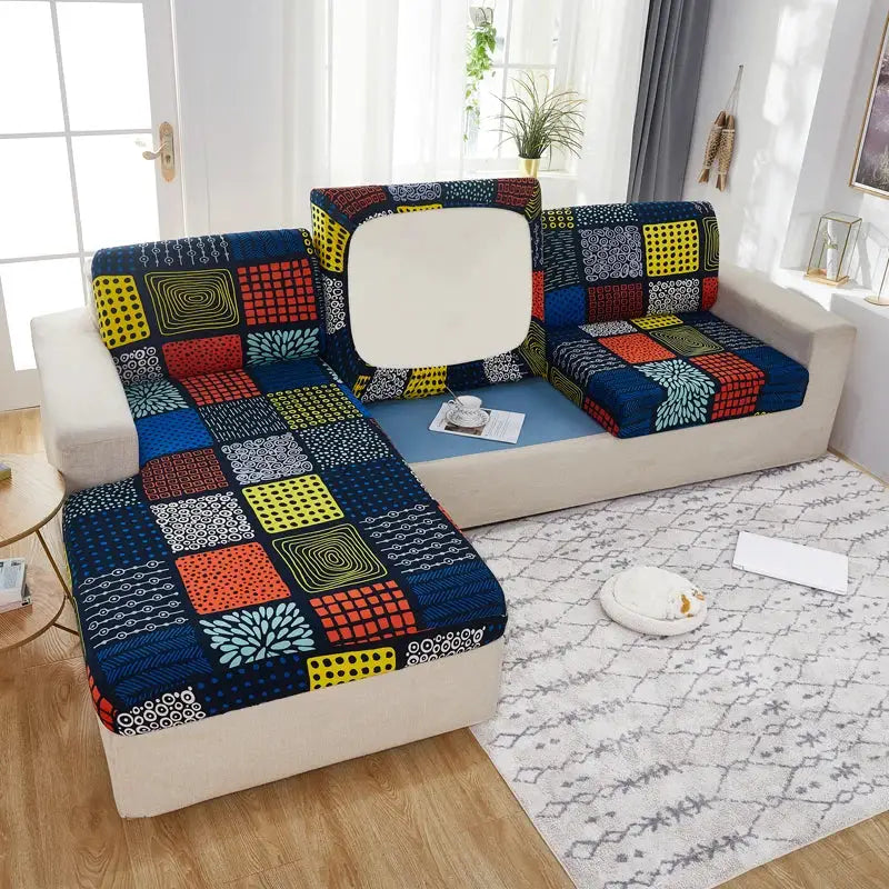 Geometric print sofa cover for corner sectional; elastic patchwork upholstery in blue, yellow and red.