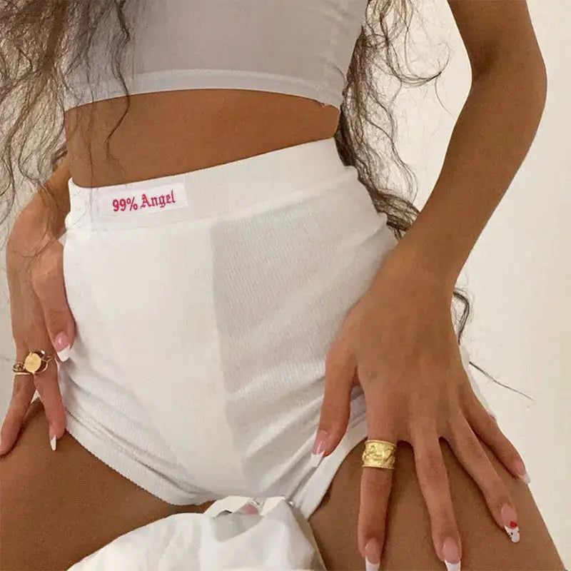 White high-waisted ribbed-knit biker shorts for women with a 99% Angel waistband label