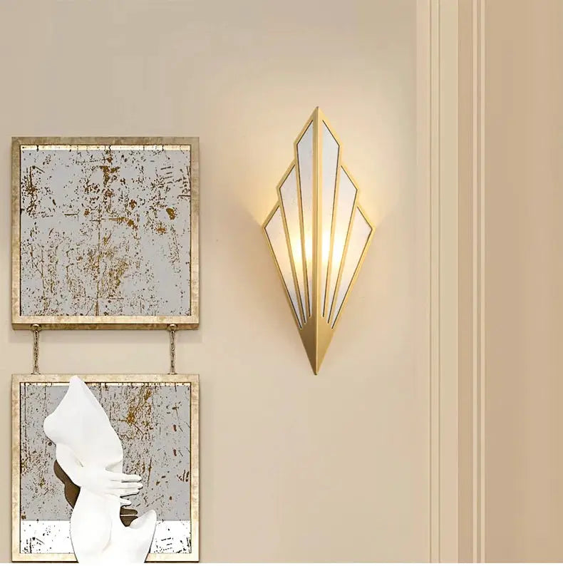 Nordic modern LED iron wall lamp by Simples Market; gold geometric sconce