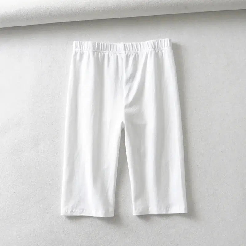 Women's white knee-length biker shorts with elastic waistband