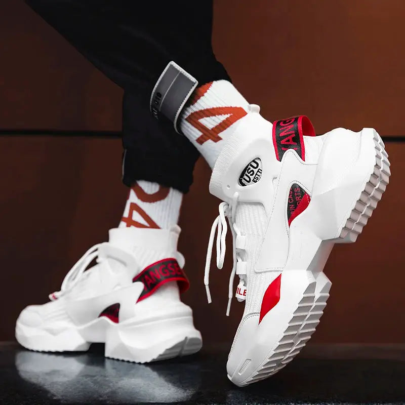 Pair of men's white running sneakers with red accents and chunky textured soles