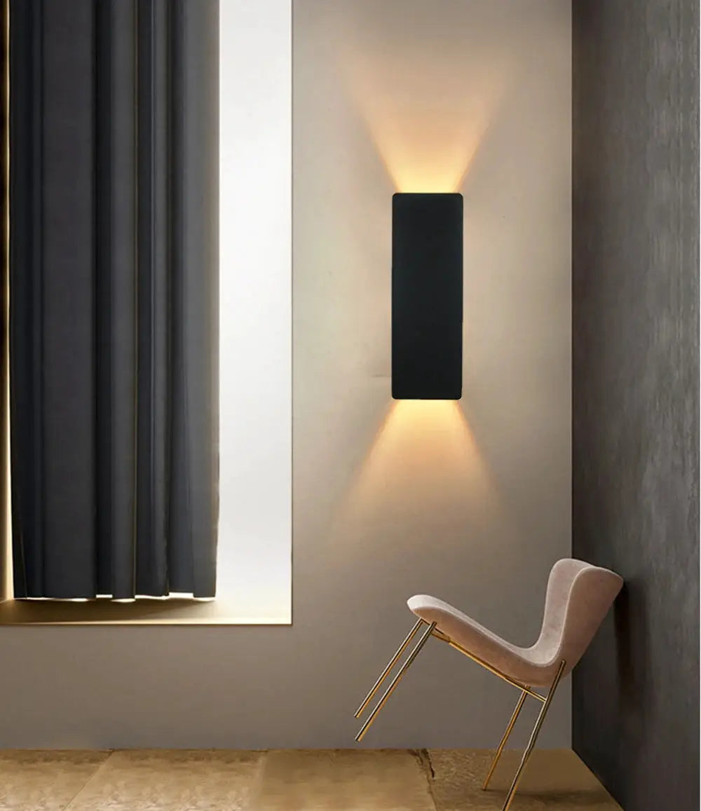 Simples Market modern LED indoor wall lamp, aluminum black rectangular fixture with warm uplight and downlight.