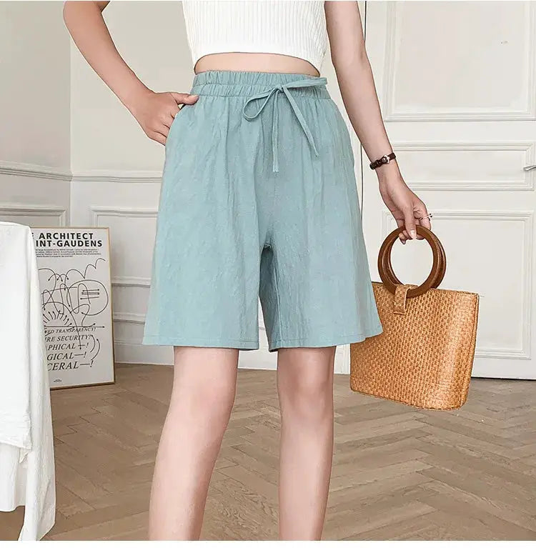 Women's cotton shorts in light blue, high-waist, loose fit with drawstring and two pockets