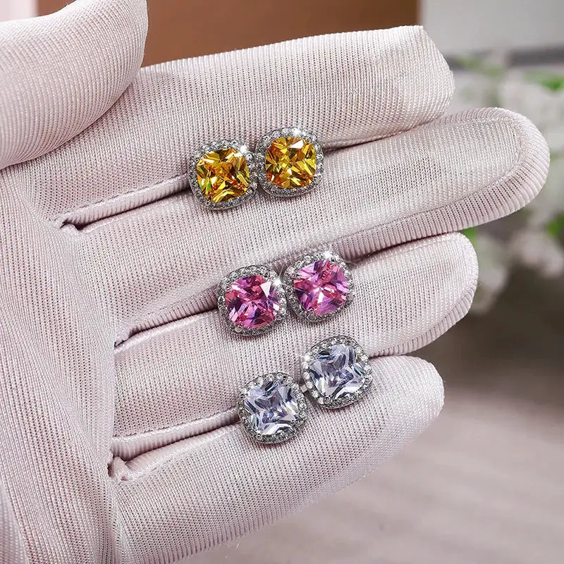 Huitan cushion shape stud earrings set: 3 pairs with brilliant cubic zirconia halos in yellow, pink, and clear-blue