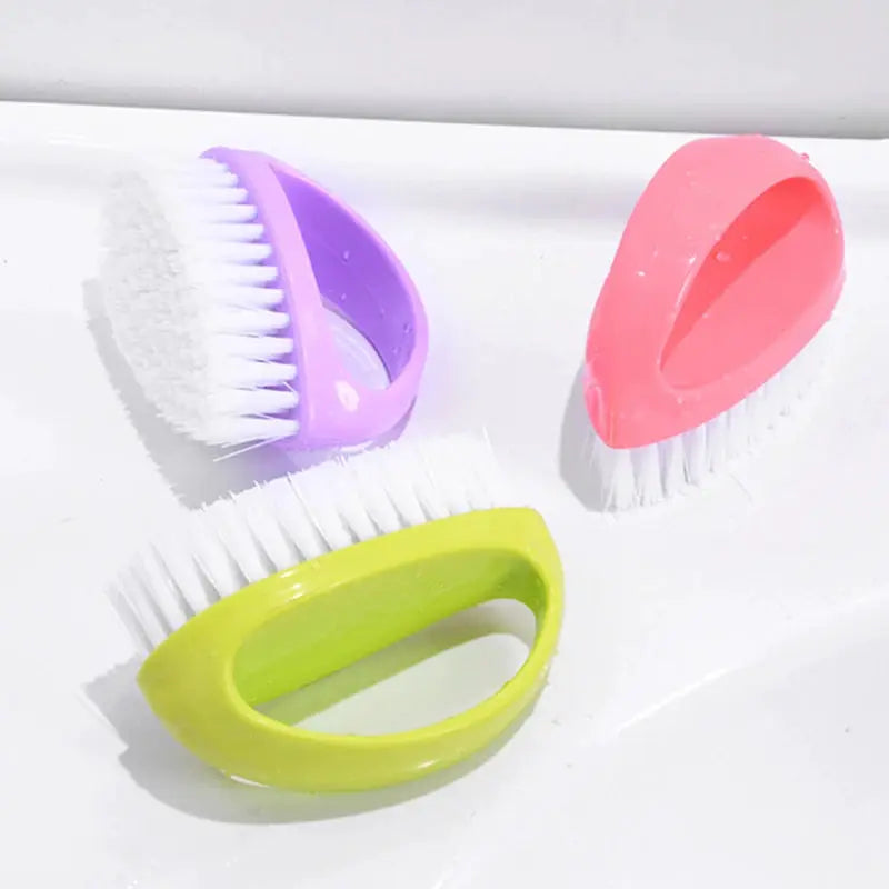 Egg-shaped colorful cleaning brush set of three with purple, pink and lime green handles and white bristles