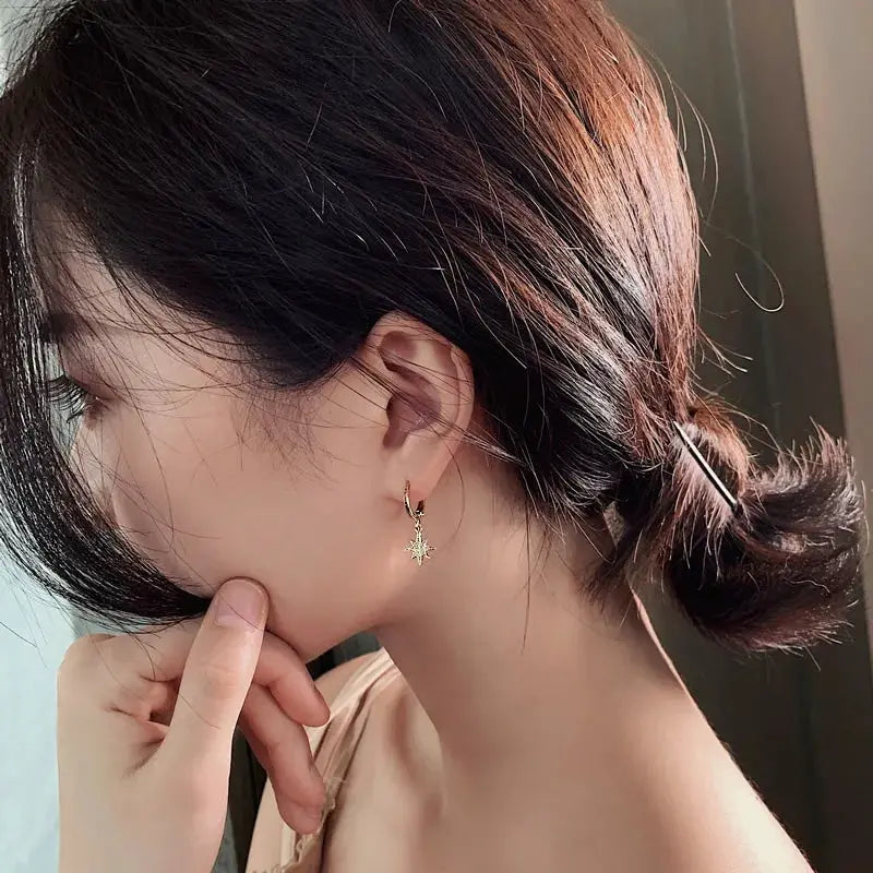 Gold-tone geometric star motif dangle earrings for women