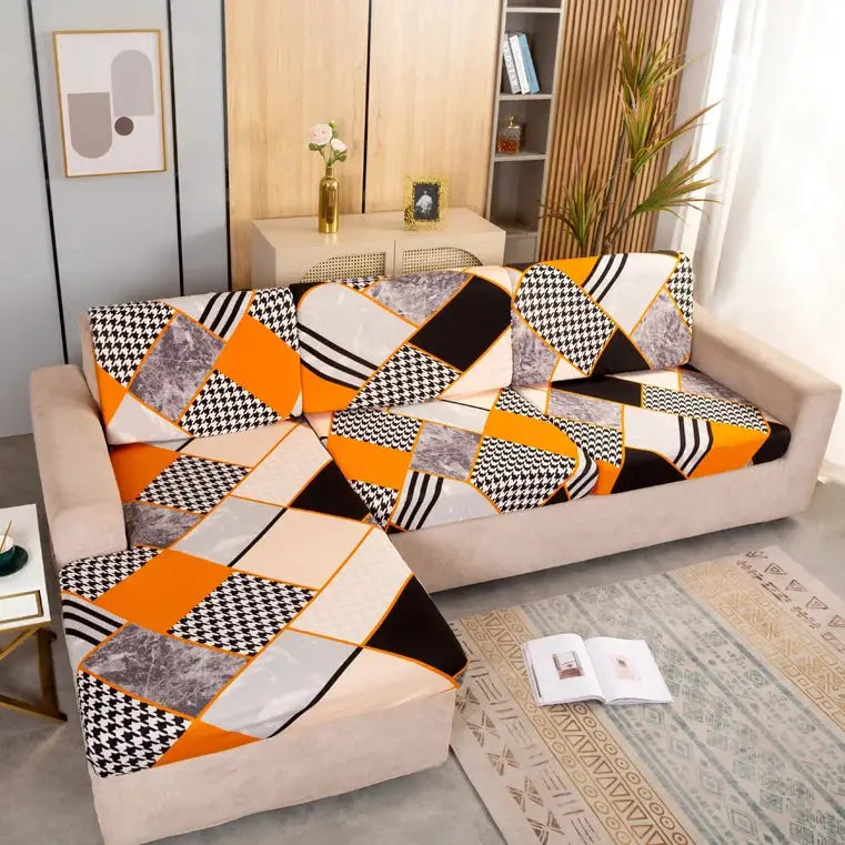 Geometric print sofa and ottoman covers by Simples Market; orange, black and white elastic slipcovers.