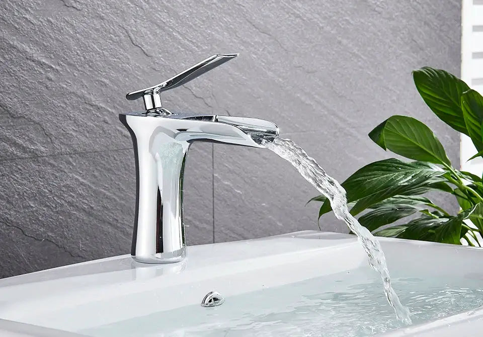 Chrome waterfall basin faucet with a single lever for bathroom sink