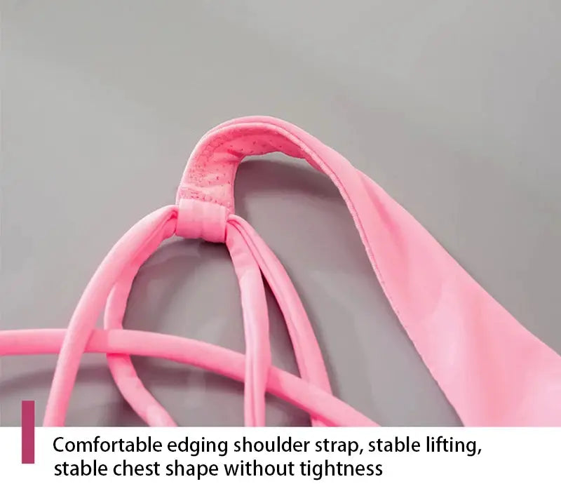 Pink fitness sports bra with cross-back straps and soft-edged design