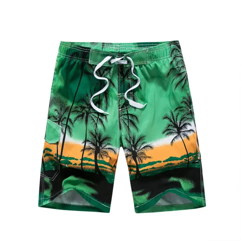 Men's board shorts in green with orange palm-tree print and white drawstring