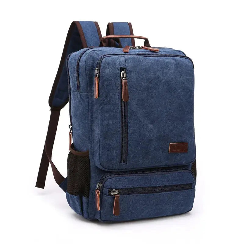 Vintage canvas backpack by Simples Market, blue with brown leather zippers and multiple compartments.