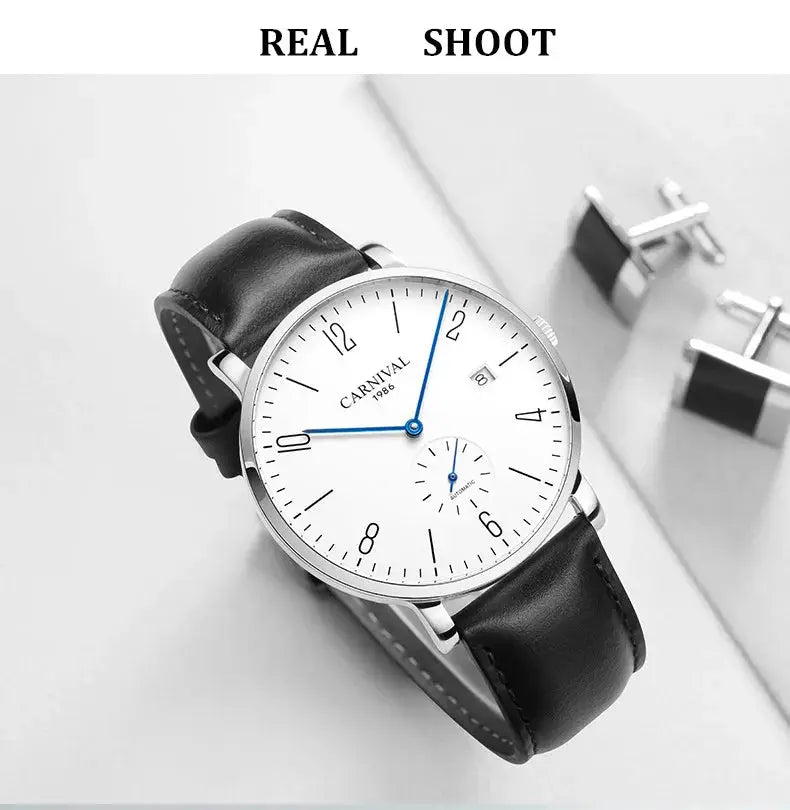 Carnival men's luxury automatic wristwatch with white dial, blue hands, black leather strap.