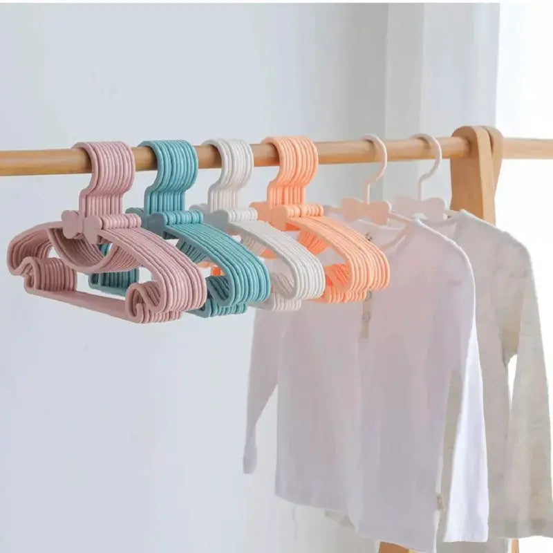 Baby clothes hangers, 5 pastel-colored plastic on a wooden rod