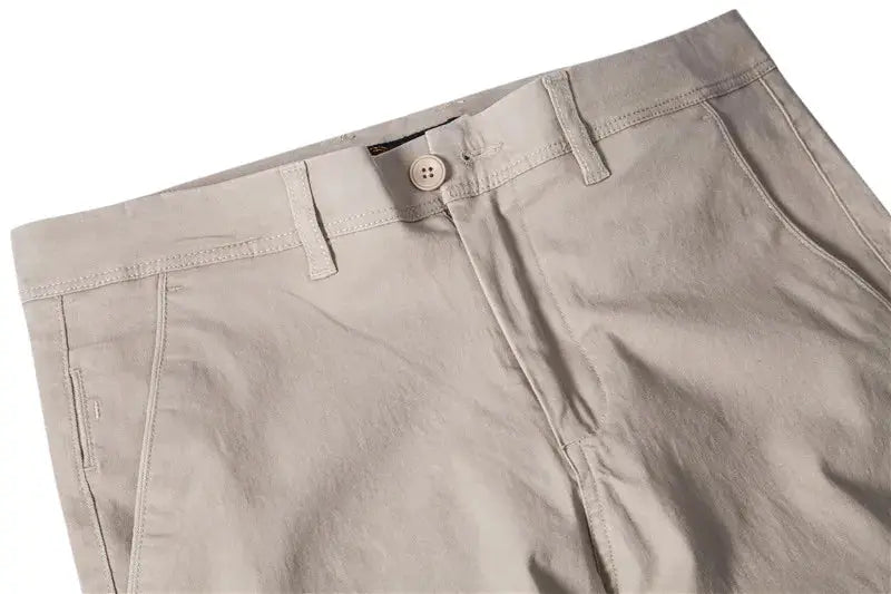 Men's beige cotton trousers, slim-fit with belt loops and button closure