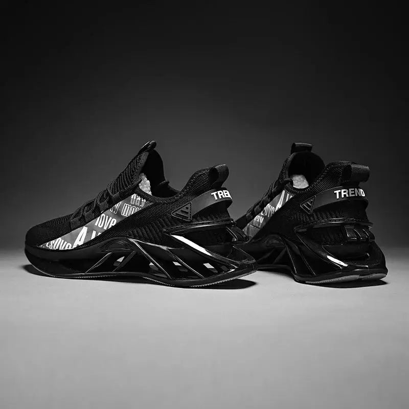 Pair of men's black sneakers with graphic white text panels and TREND heel straps; athletic fashion trainers.