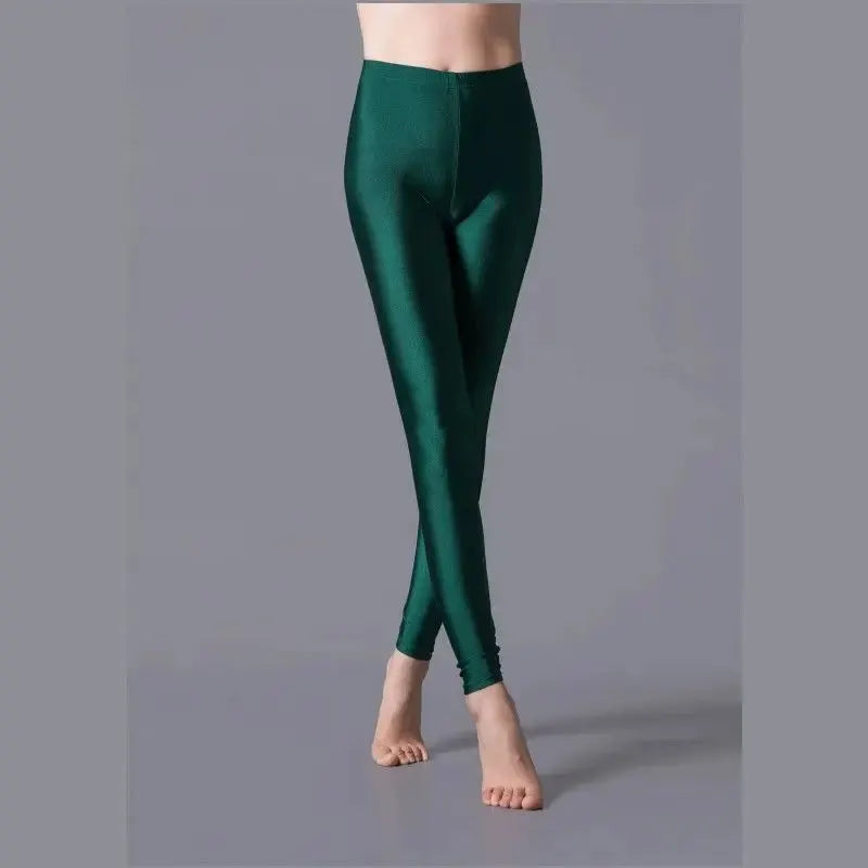 Women shiny emerald green metallic leggings; stretchy spandex, high-waisted and form-flattering