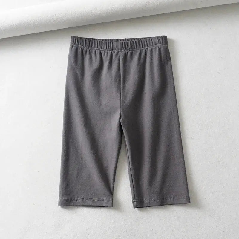 Biker shorts for women, high-waist knee-length, solid gray with elastic waistband, Simples Market.