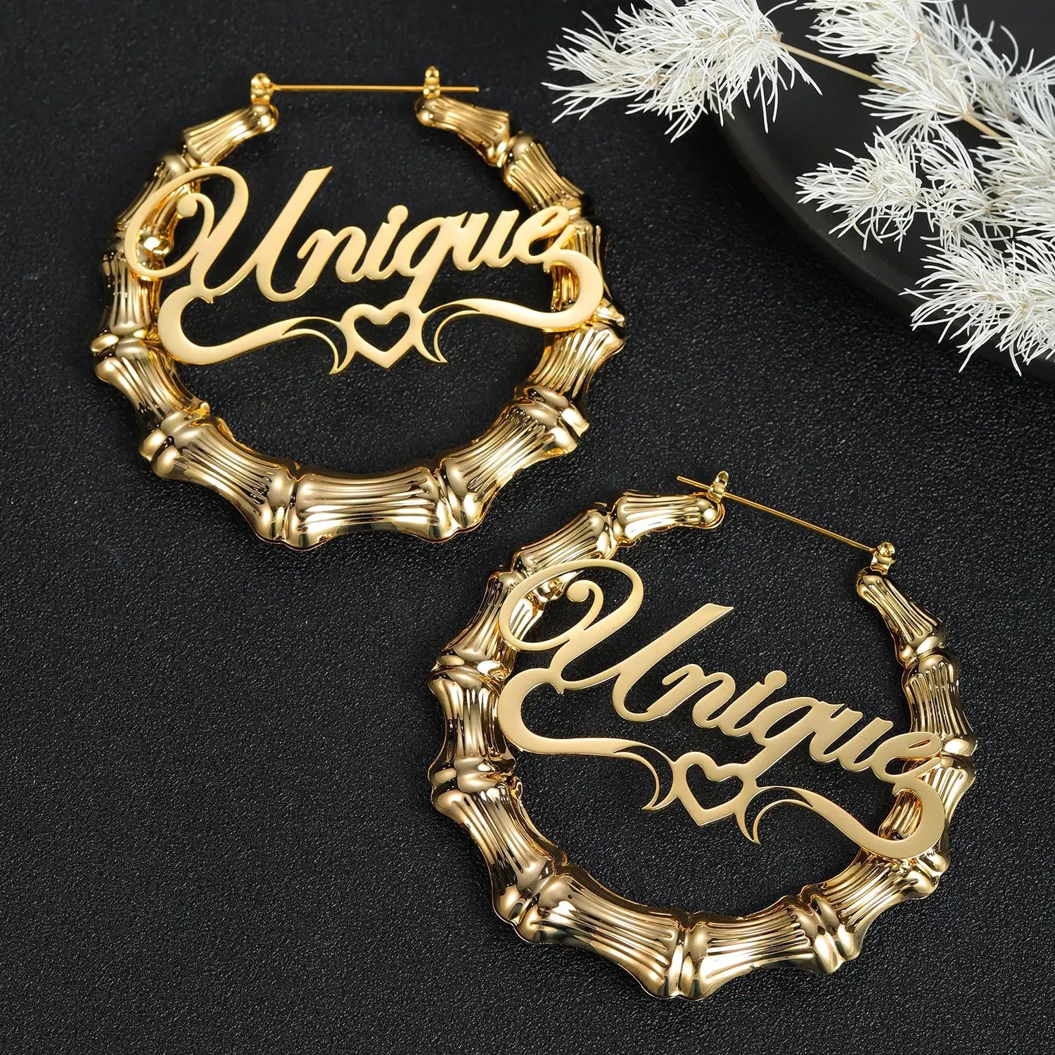Gold-tone bamboo hoop earrings, stainless steel pair with Unique name-drop script design.