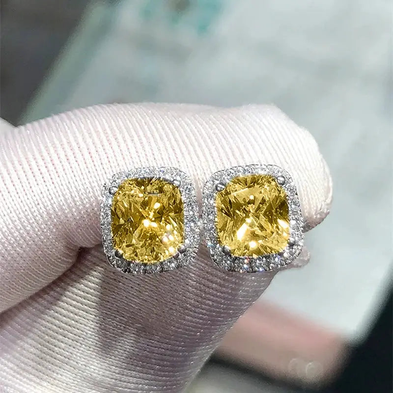 Huitan cushion-shape stud earrings; yellow cubic zirconia with a halo of clear stones; pair