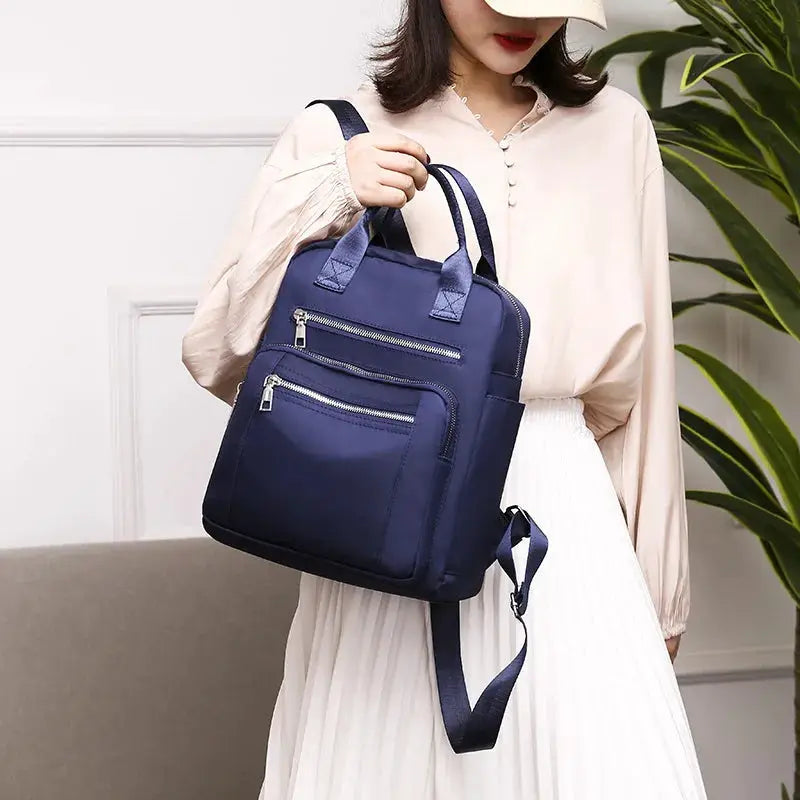 Women travel backpack, navy blue Oxford, waterproof with two front zip pockets