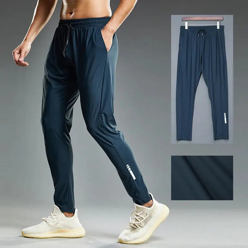 Simples Market men's navy blue running joggers with elastic drawstring waist and tapered legs, fabric texture
