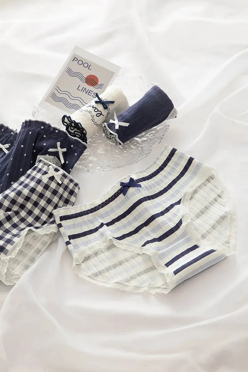 Cotton women's underwear 5-pack by Simples Market in navy/white stripes, gingham, and dot prints with bow trim