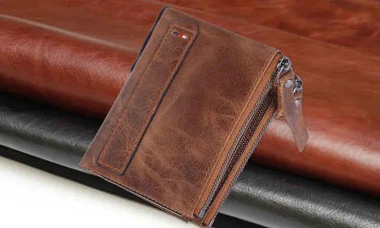 Brown leather men's wallet with zip-around coin pocket and front card slot