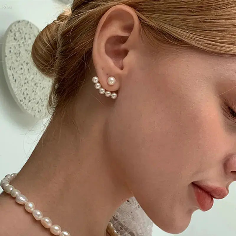 Imitation pearl stud earrings with a curved pearl climber in white pearls, two-piece set