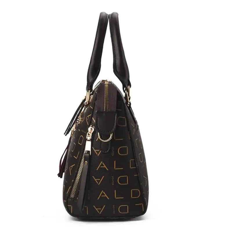 Simples Market English-letter PU leather handbag, black with gold lettering, top-handle tassel tote, large capacity.