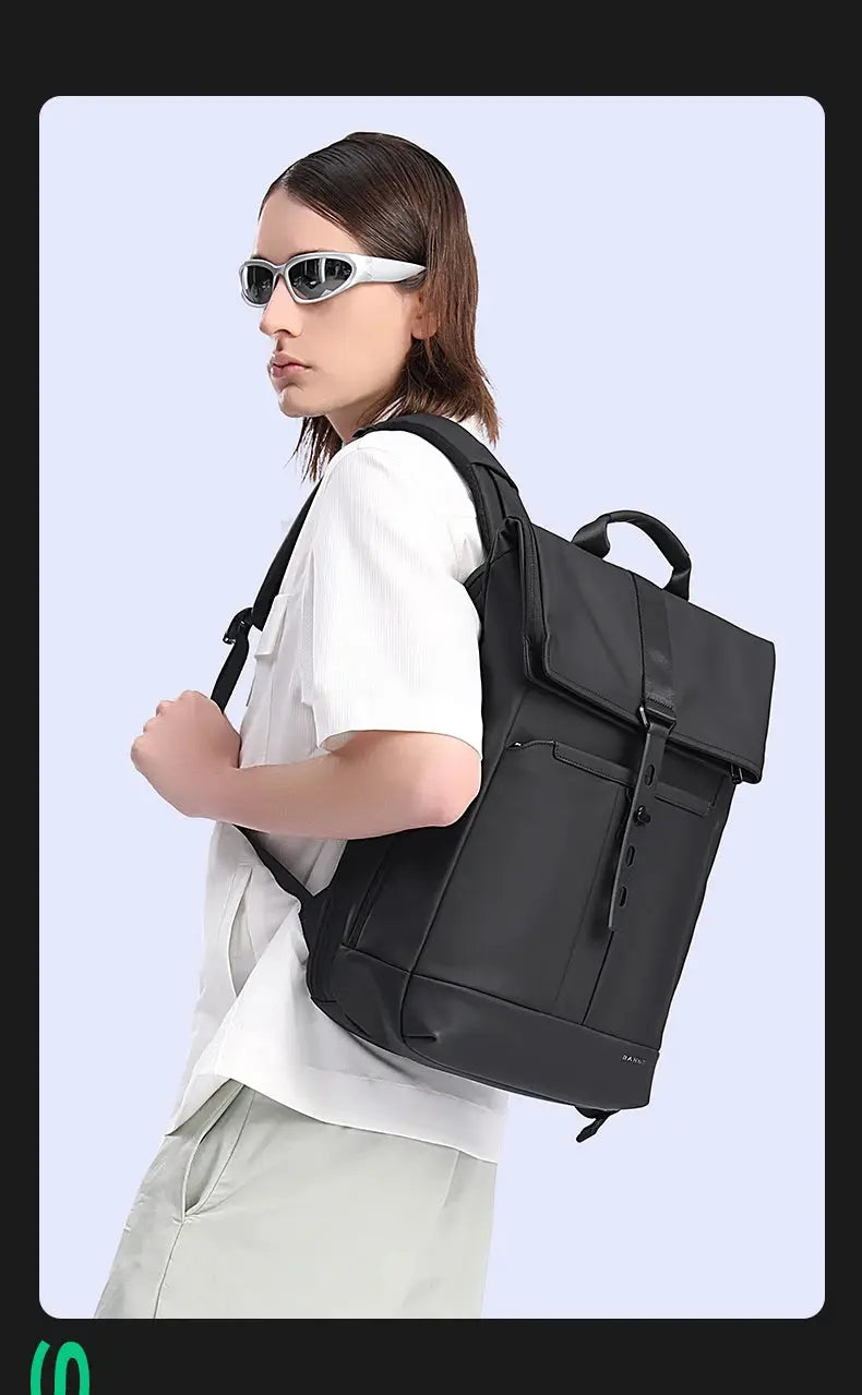 Laptop backpack by BANGE, anti-theft waterproof 15.6-inch, black, Simples Market brand, shown worn by man
