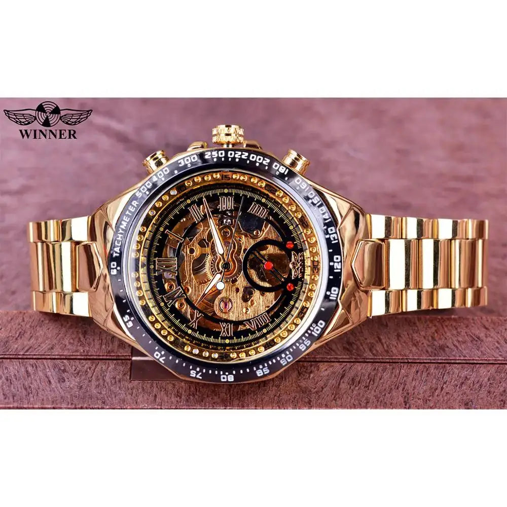 Winner skeleton mechanical men's watch with gold-tone bracelet and black tachymeter bezel