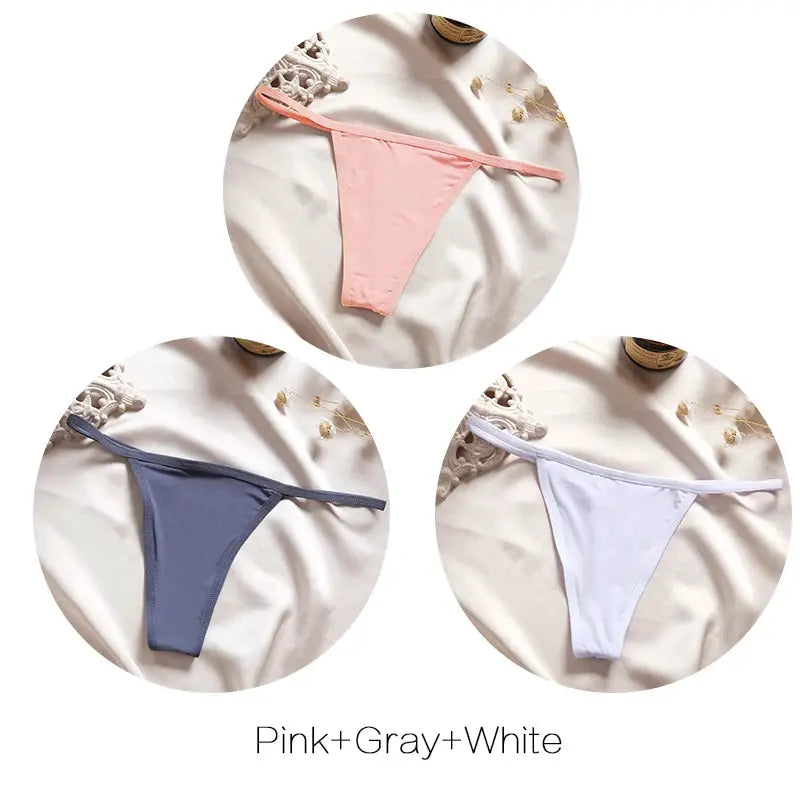 Simples Market three-pack thong panties in pink, gray, and white; low-rise T-back/G-string style.