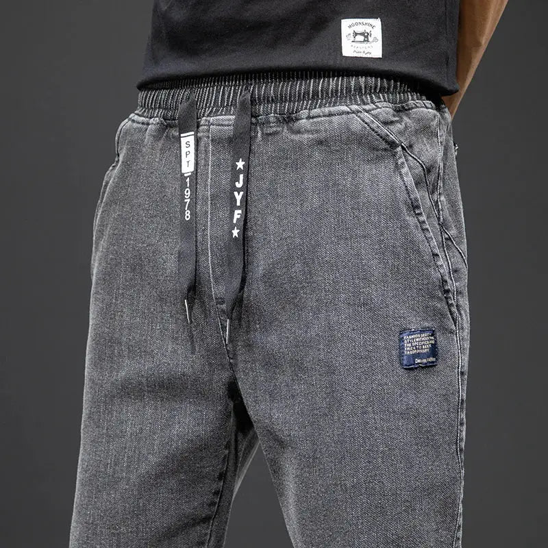 Men's cargo denim jogger jeans with drawstring waist, gray wash, side pockets, baggy harem style