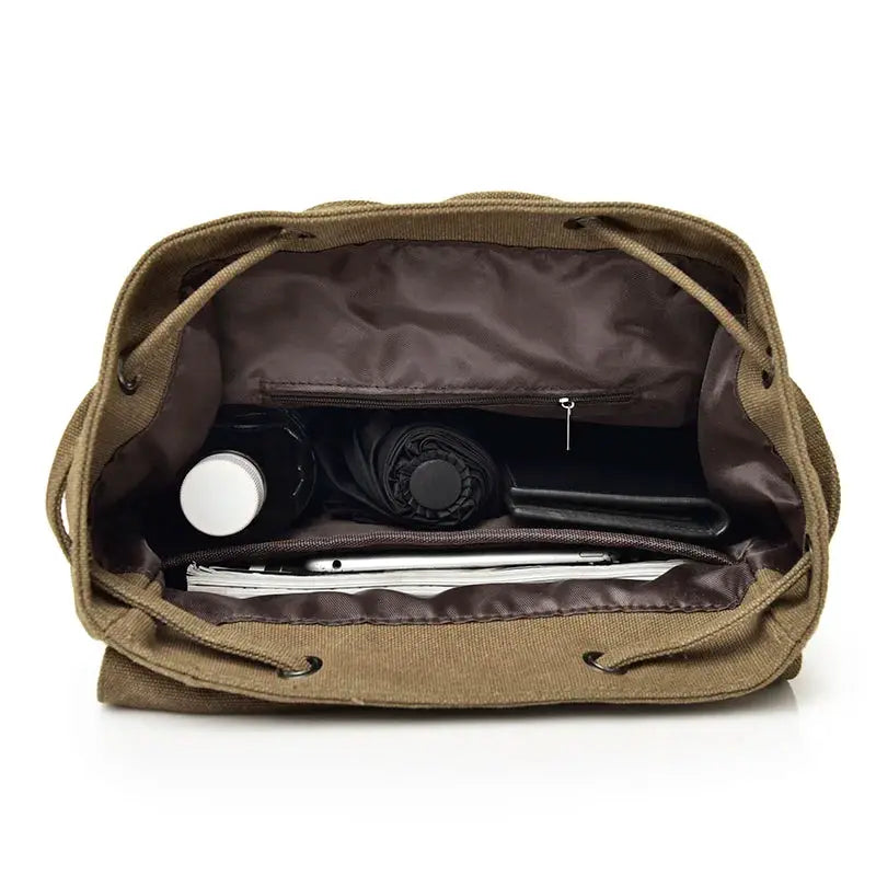 Simples Market canvas men's backpack, large brown bag, open interior with water bottle and papers
