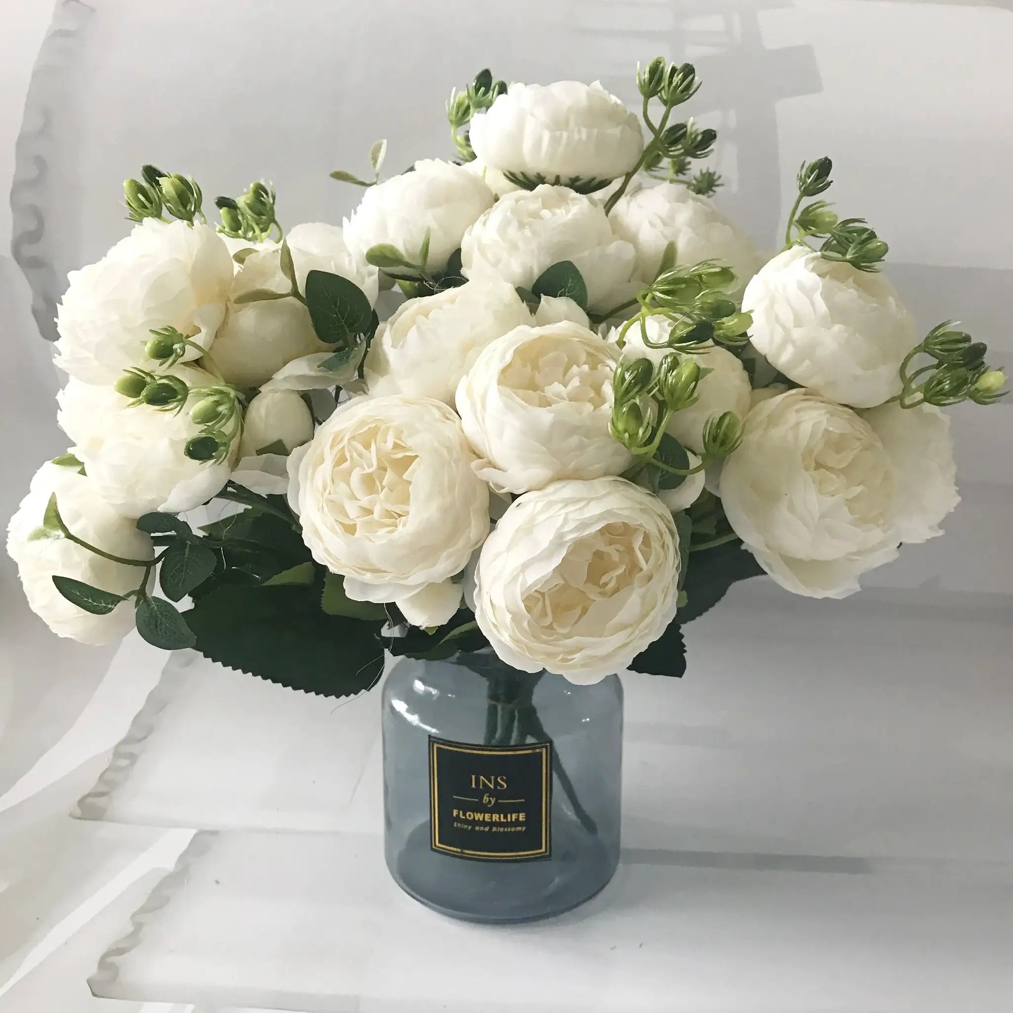 30cm white silk peony bouquet in a dark vase with FLOWERLIFE branding visible