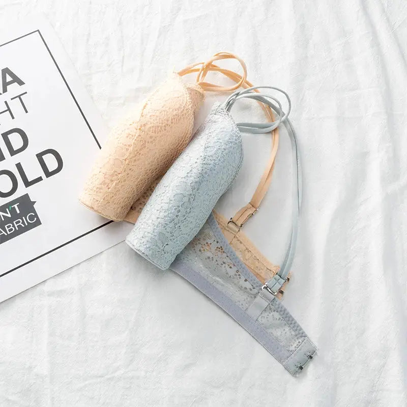 Simples Market lace bralette set; three pastel floral wireless bras in peach, blue, and gray.