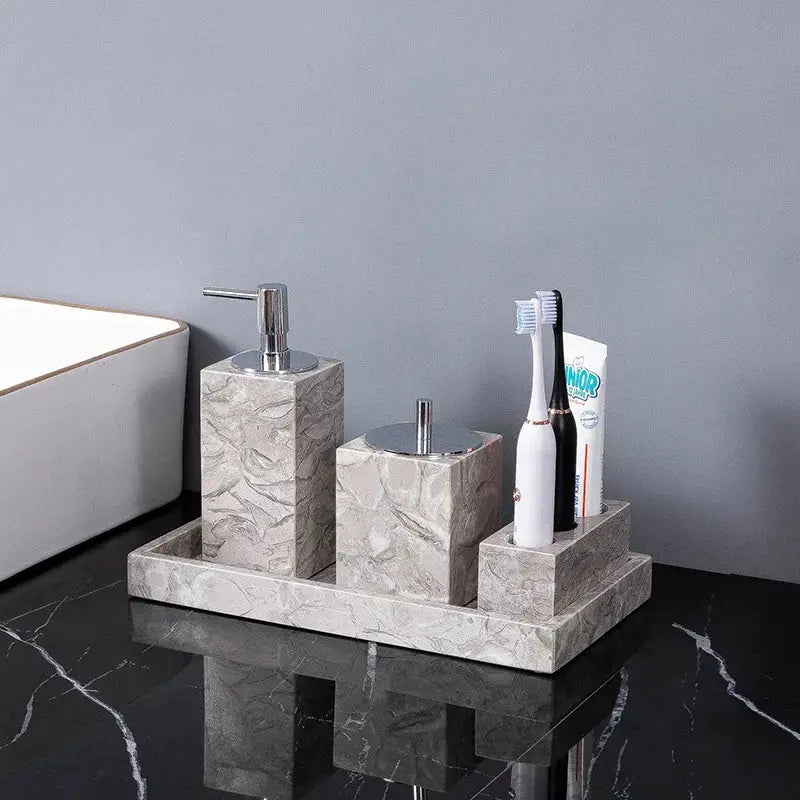 Natural marble bathroom accessories set of 4 with soap dispenser, toothbrush holder, cup and soap dish on a tray