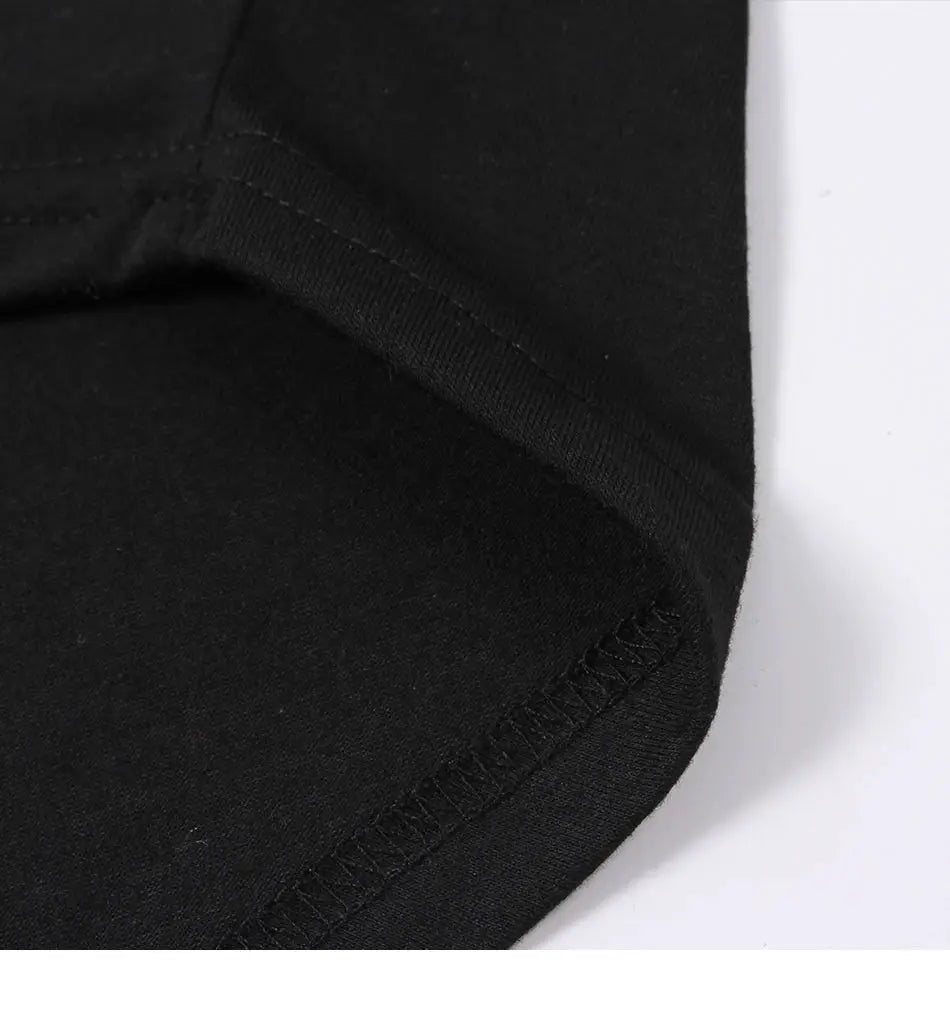 Cotton irregular women blouse, black long sleeve fabric close-up showing hem and seam