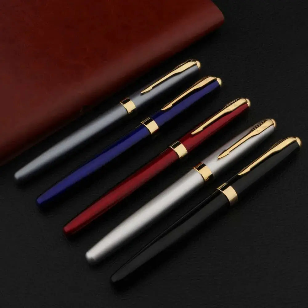 Five metal fountain pens with gold-tone clips in black, blue, red, silver, and gray.