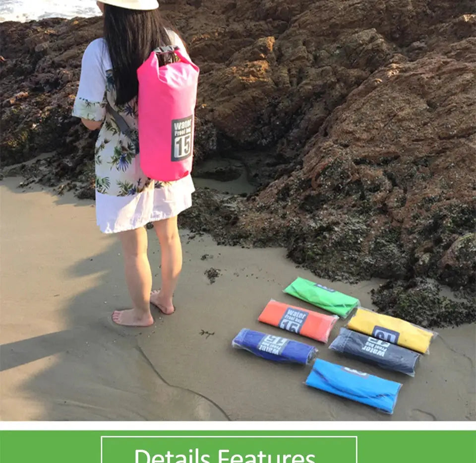 PVC waterproof dry bag, double-shoulder pink backpack worn by a person at the beach; six colorful dry bags on sand