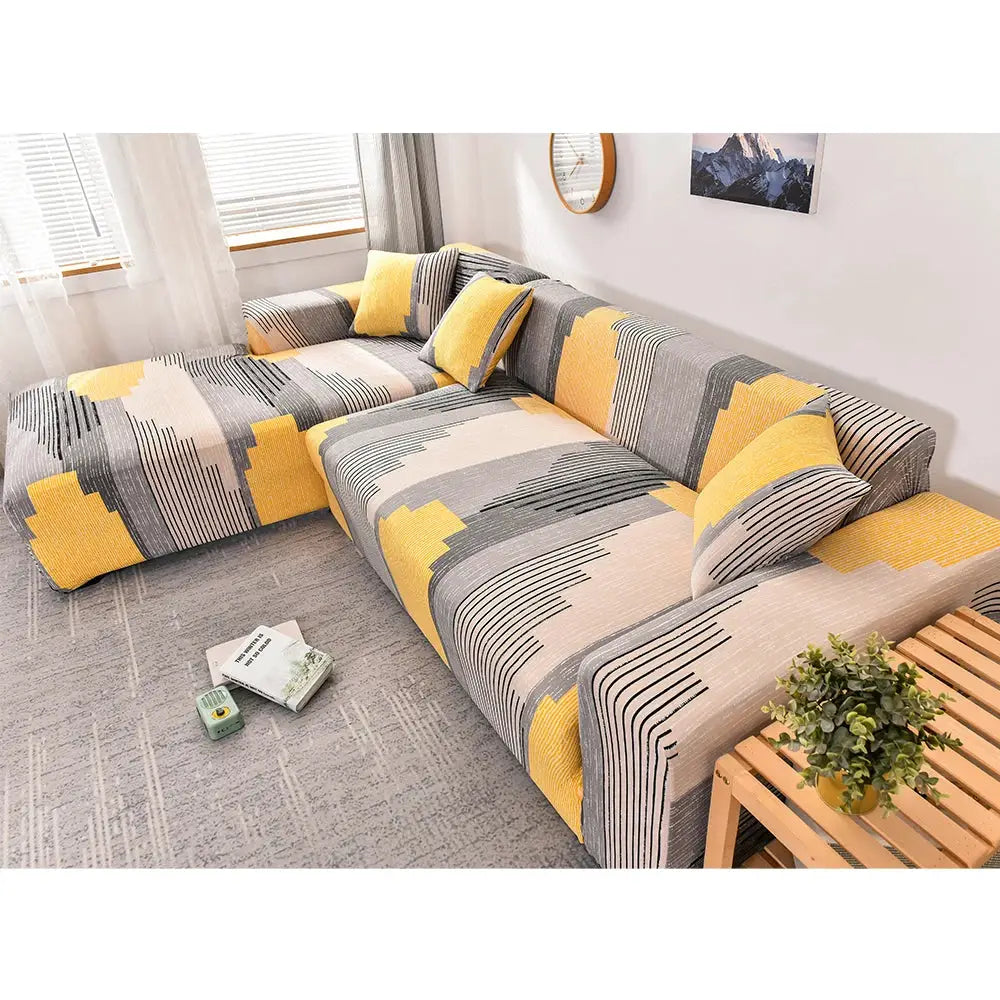 Sofa slipcover for L-shaped corner sofa; elastic stretch cover in yellow-gray geometric print.