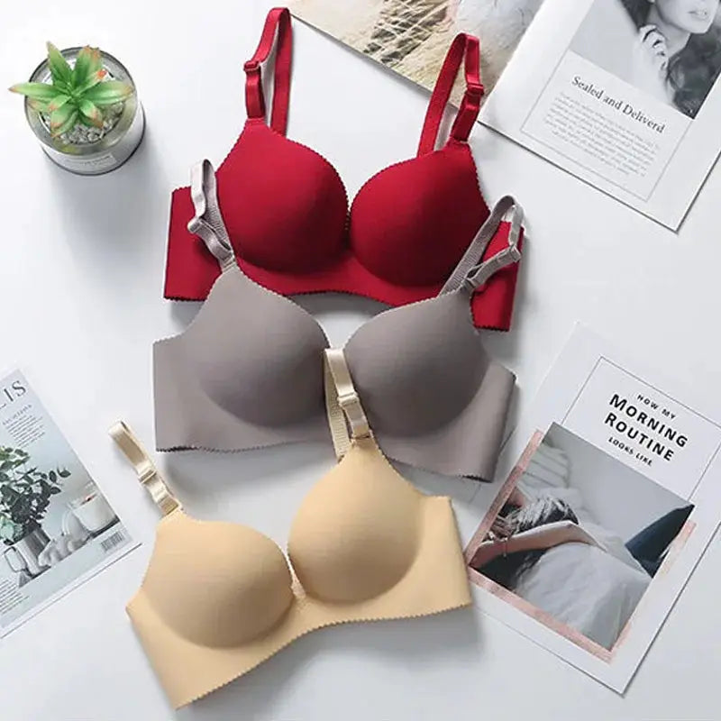 Three Simples Market seamless push-up bras in red, gray, and beige with adjustable straps