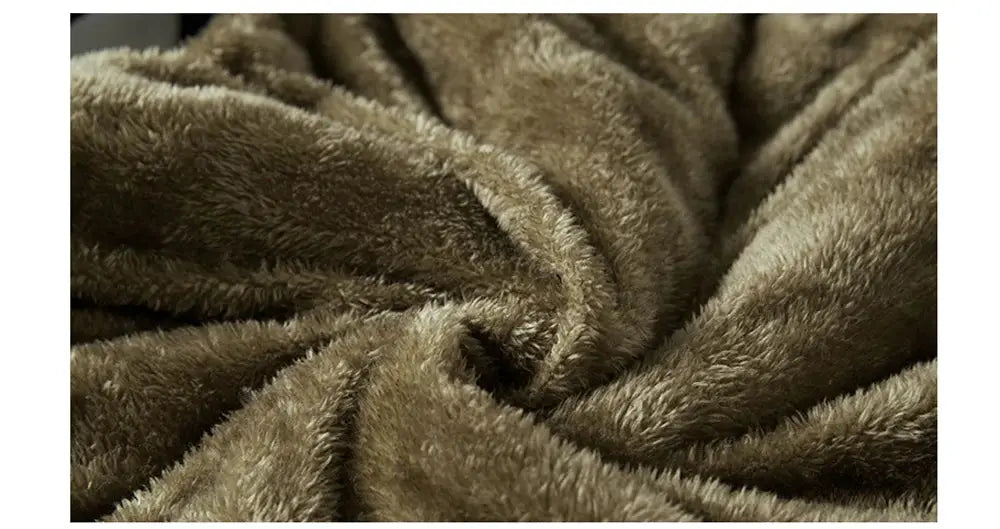 Men's brown fleece vest close-up showing soft plush texture