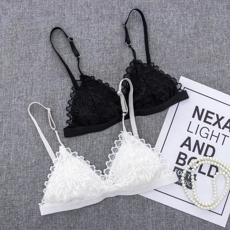 Two lace bralettes in black and white with adjustable straps, wire-free and unpadded.