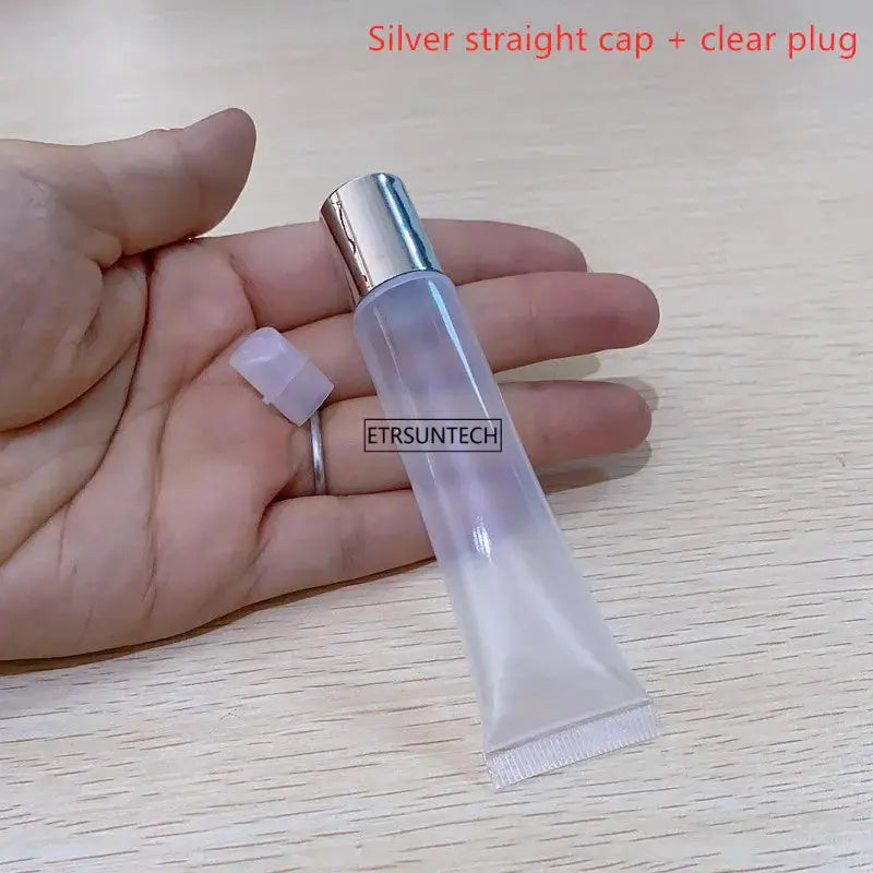 Clear lip gloss tube with detachable silver cap, empty cosmetic container by Simples Market