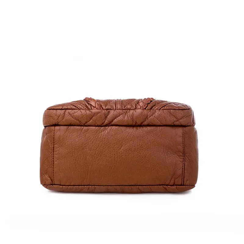 Bottom-view brown textured PU leather messenger bag for women; compact shoulder bag