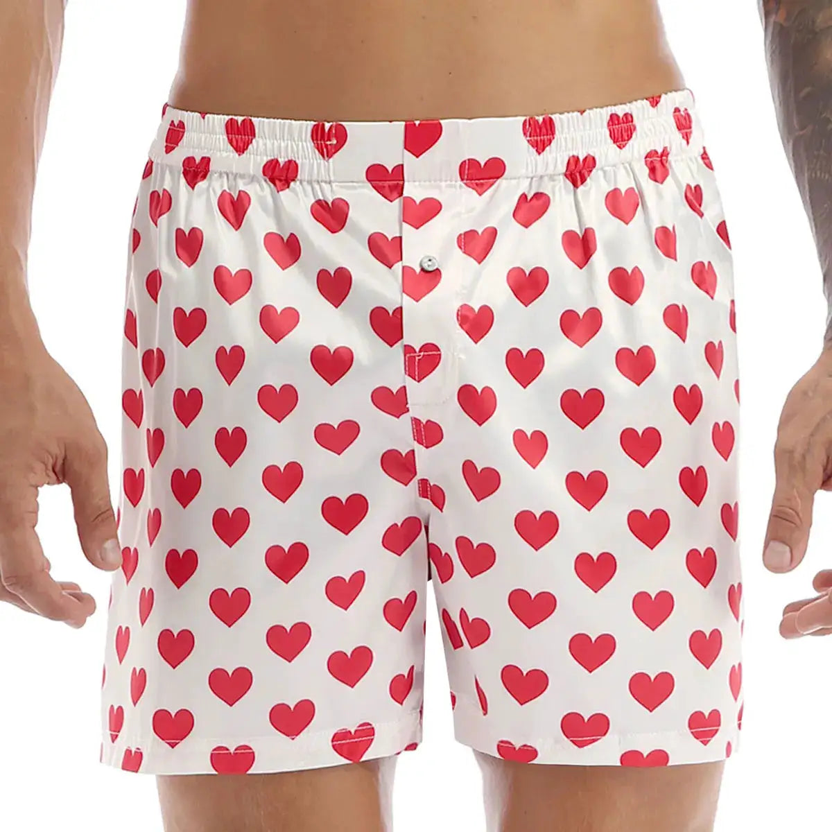 Mens white boxer shorts with red heart print, elastic waistband, lightweight beachwear